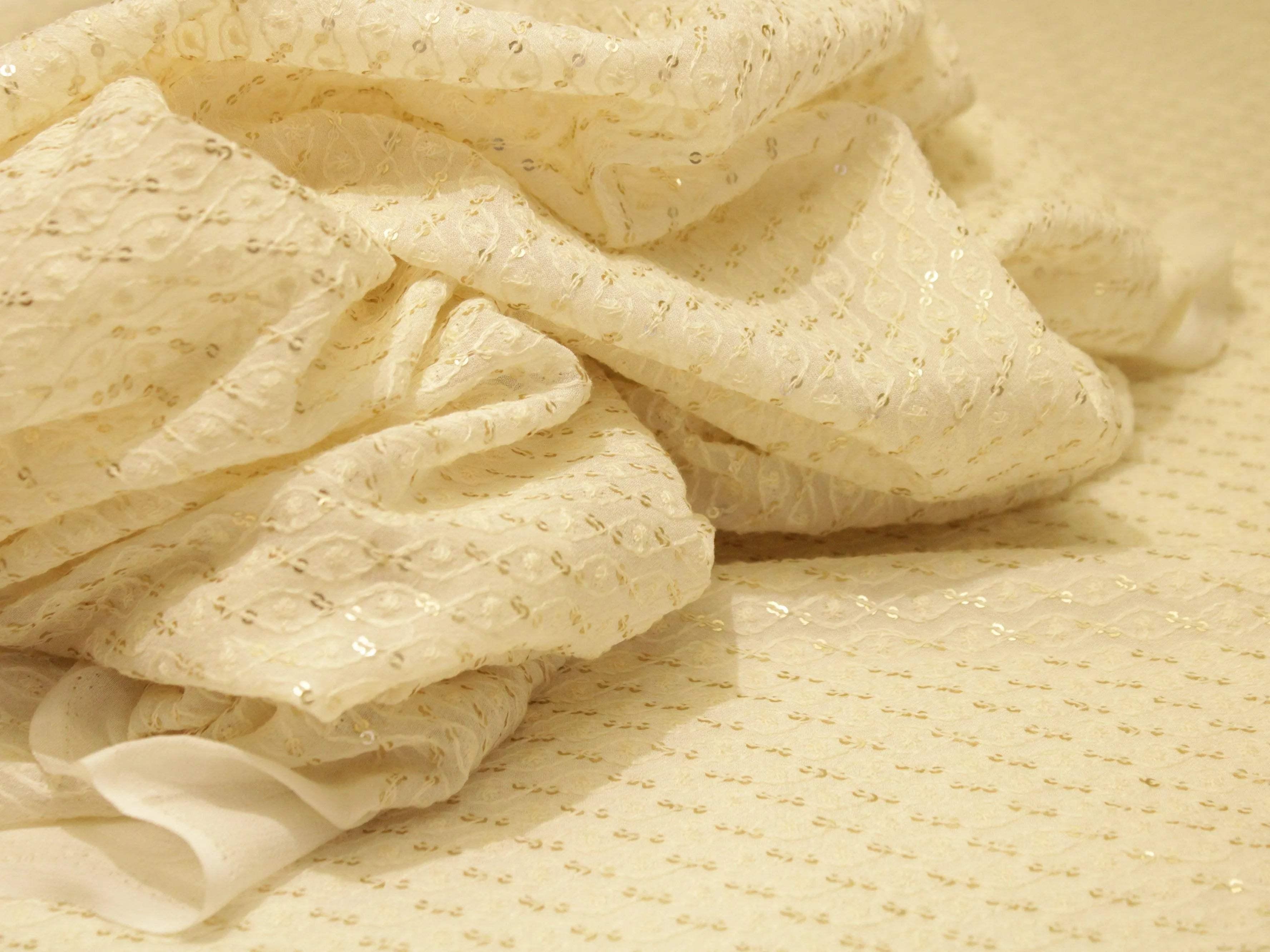 Cream Chanderi fabric with gold sequin embroidery, lightweight and elegant textile