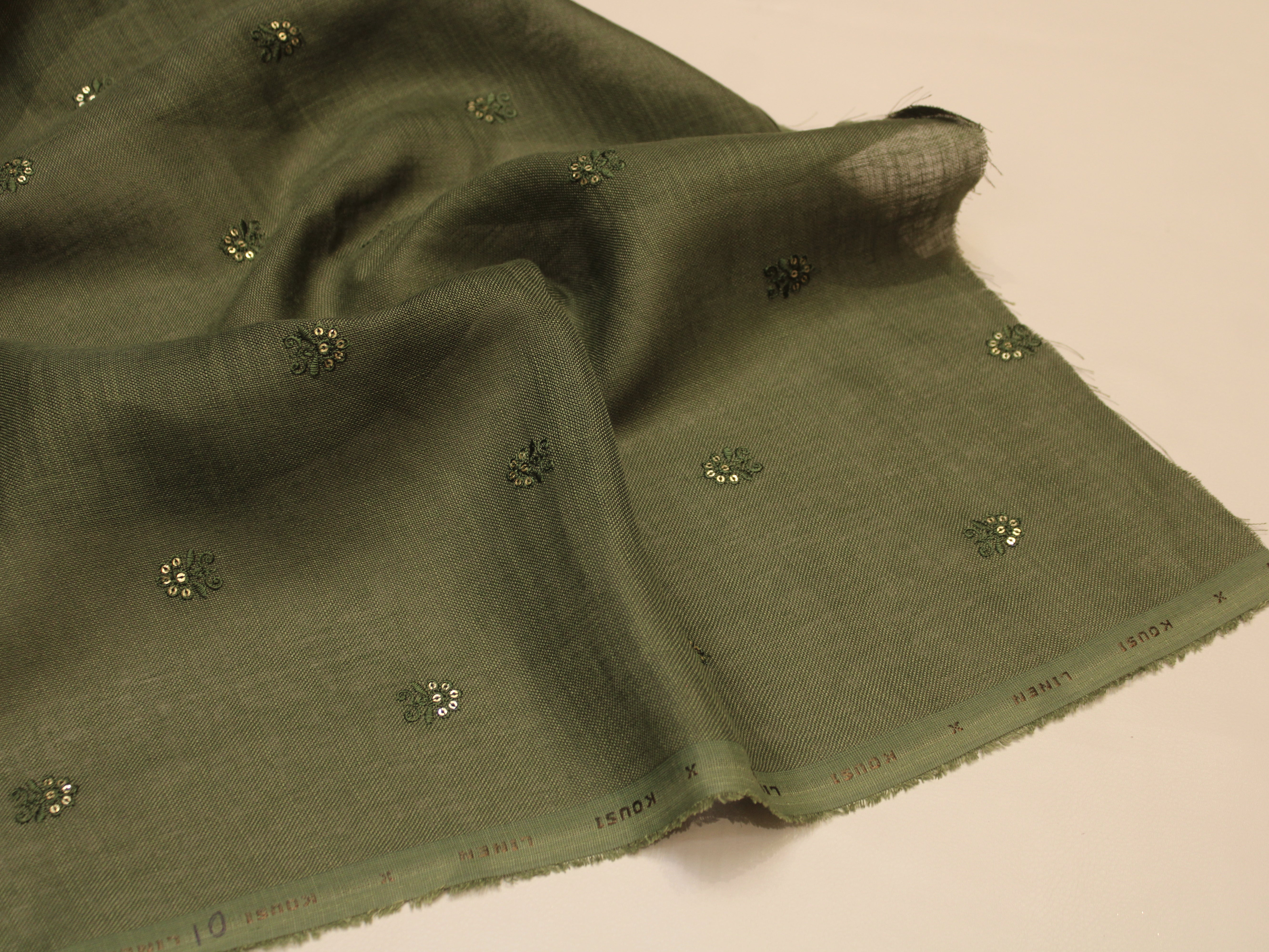 Cotton Linen Texture Fabric with Zari & Thread Motifs Embroidery - Emerald Green