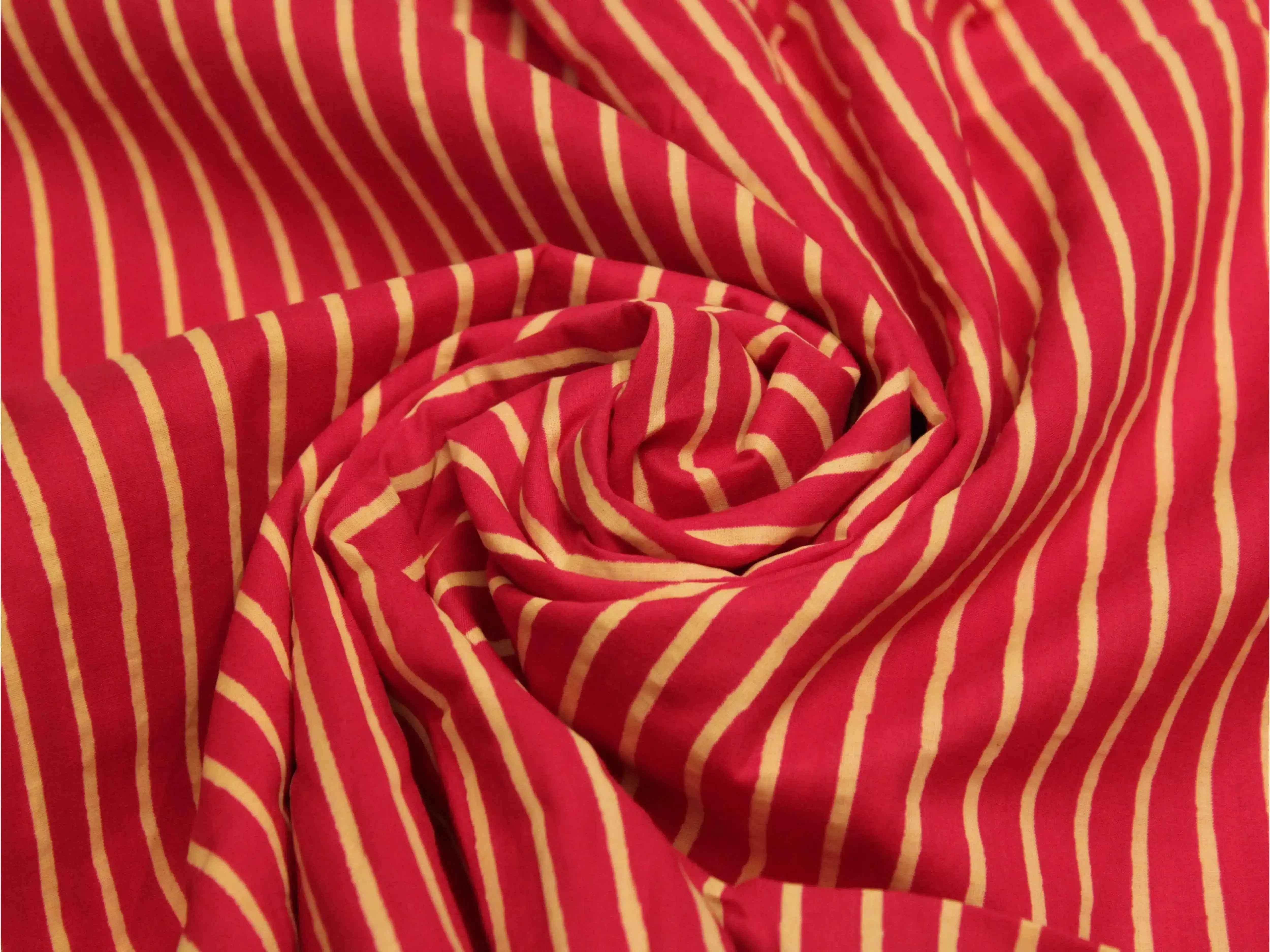 Red and yellow striped Indian cotton fabric with soft, gathered folds