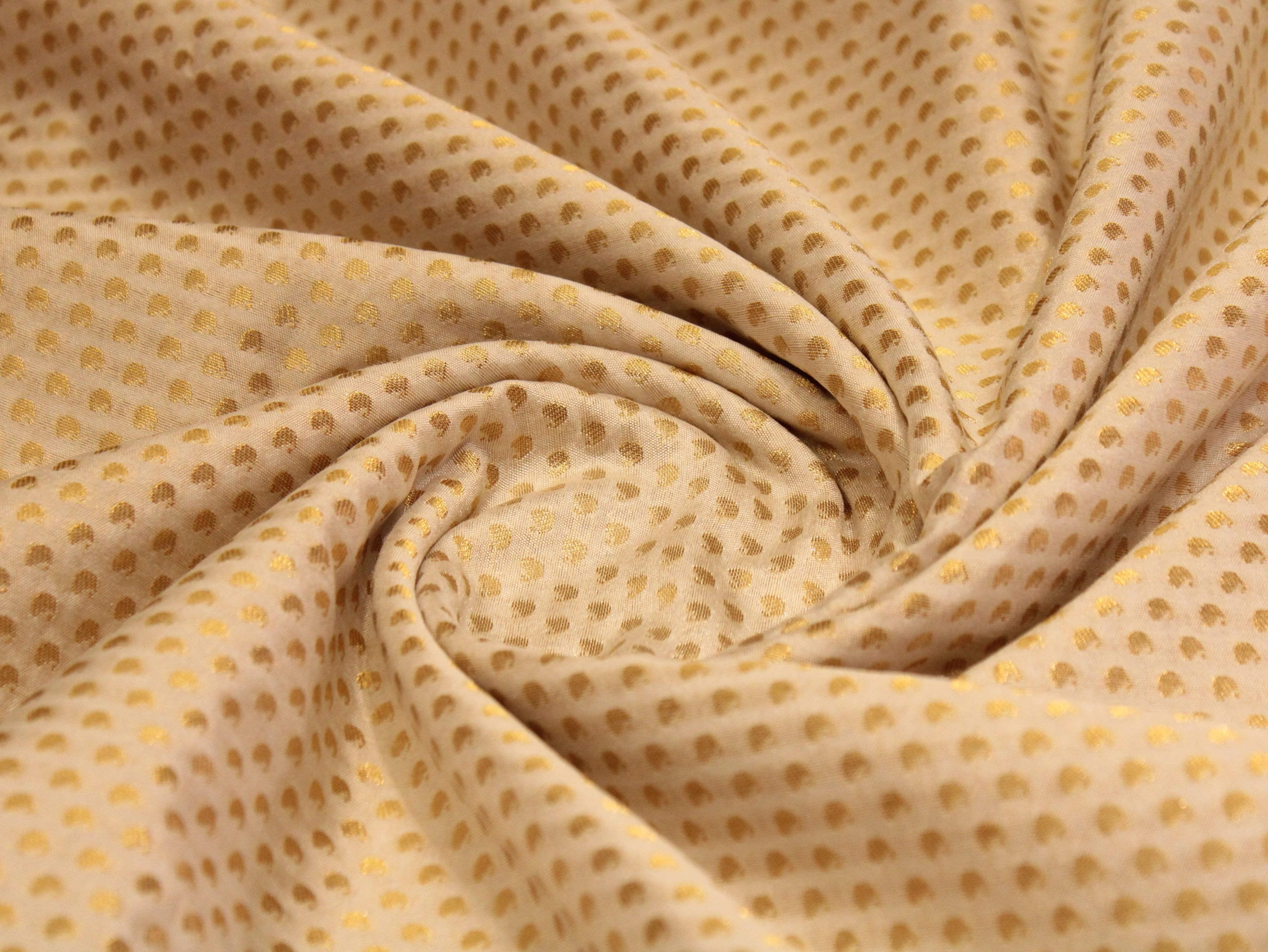 Off-white Banarasi brocade fabric with gold polka dot pattern, suitable for dyeing