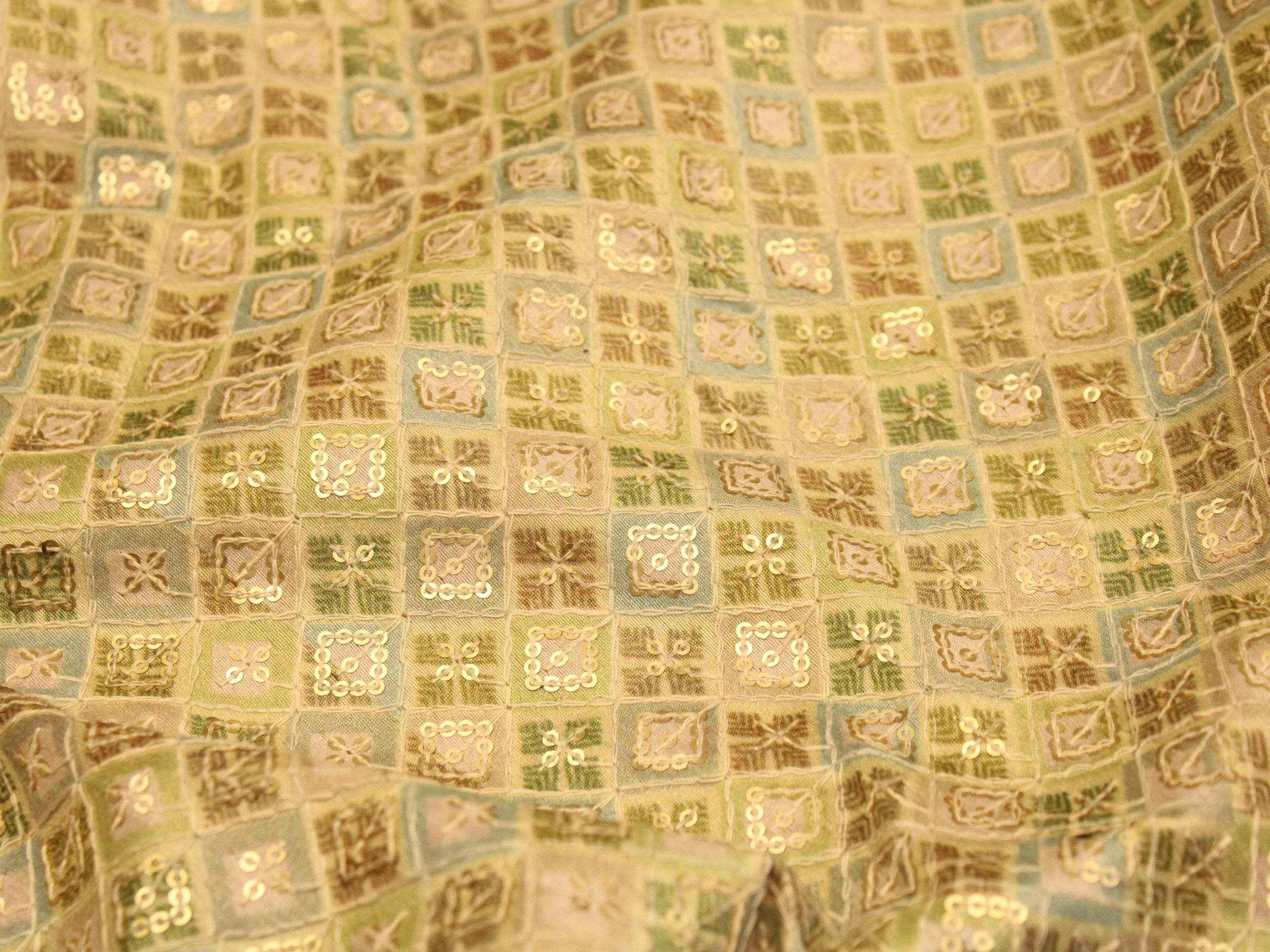 Pista green silk digital print fabric with geometric square pattern and sequin embroidery