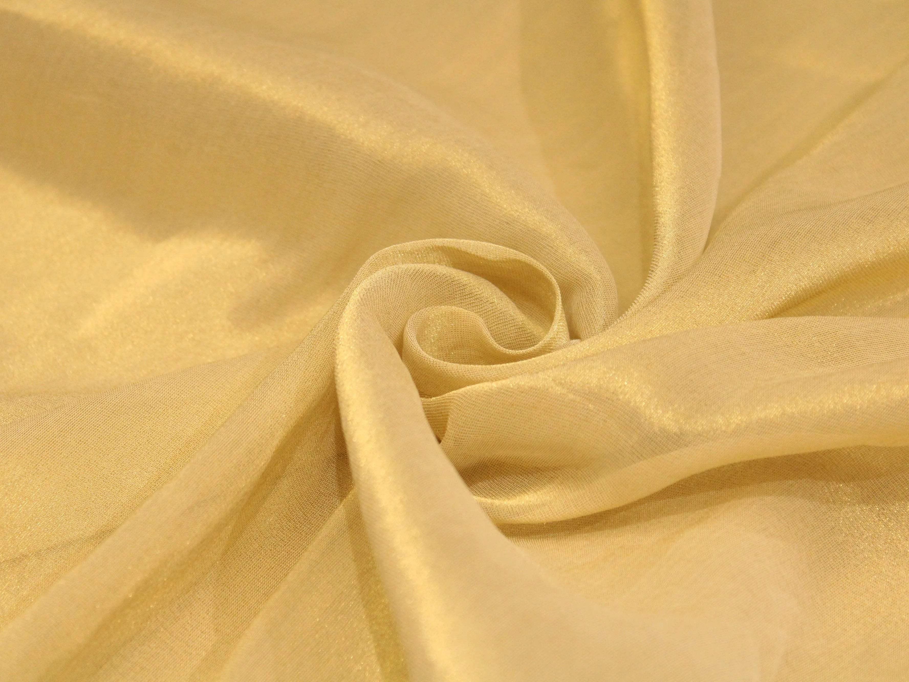 Golden dyeable chinon tissue silk fabric with a soft, shimmery texture, draped in folds