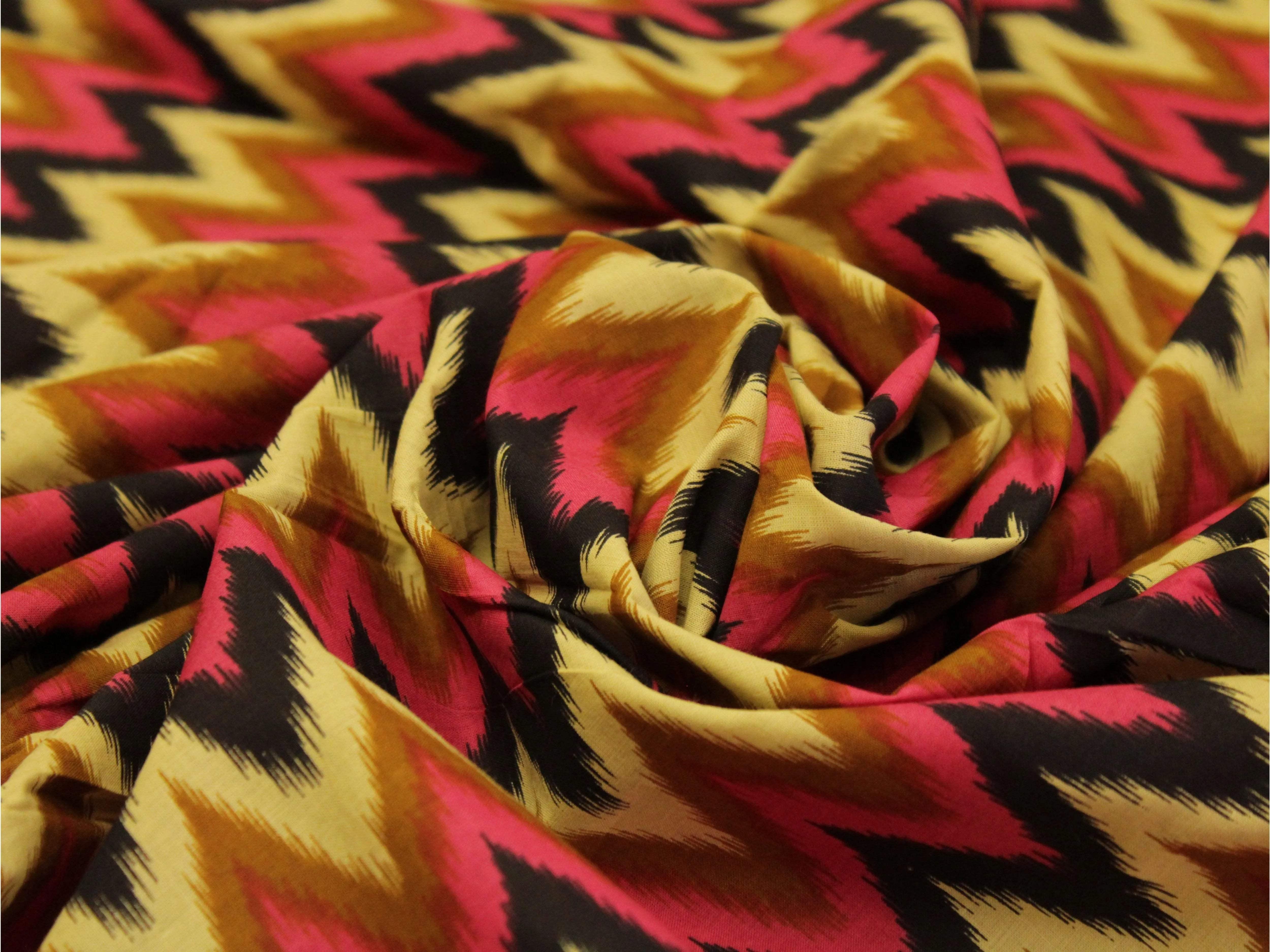 premium cotton fabric with bold zigzag print in yellow, red, and black