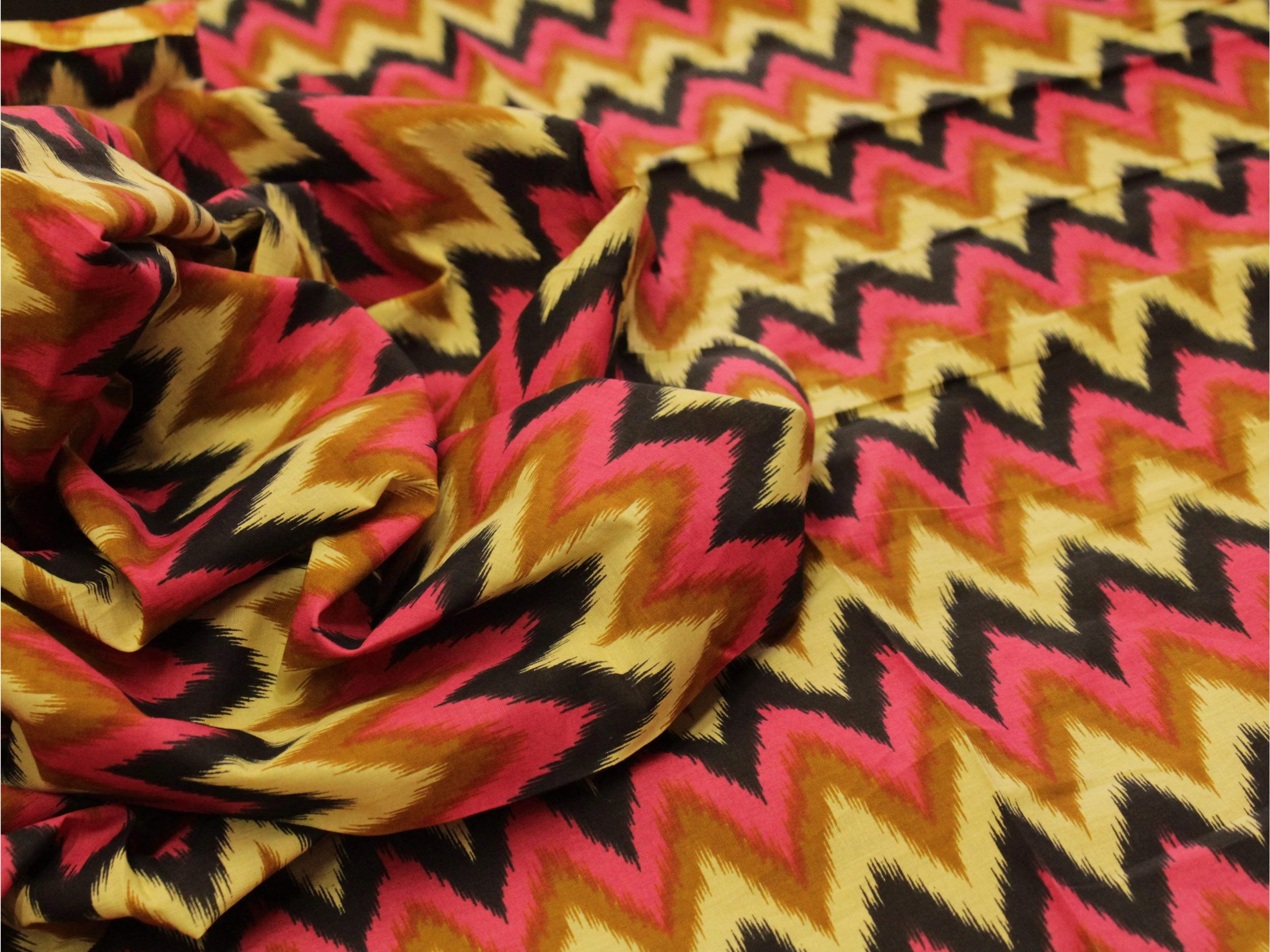 Colorful zigzag patterned cotton printed fabric with yellow, pink, and black design