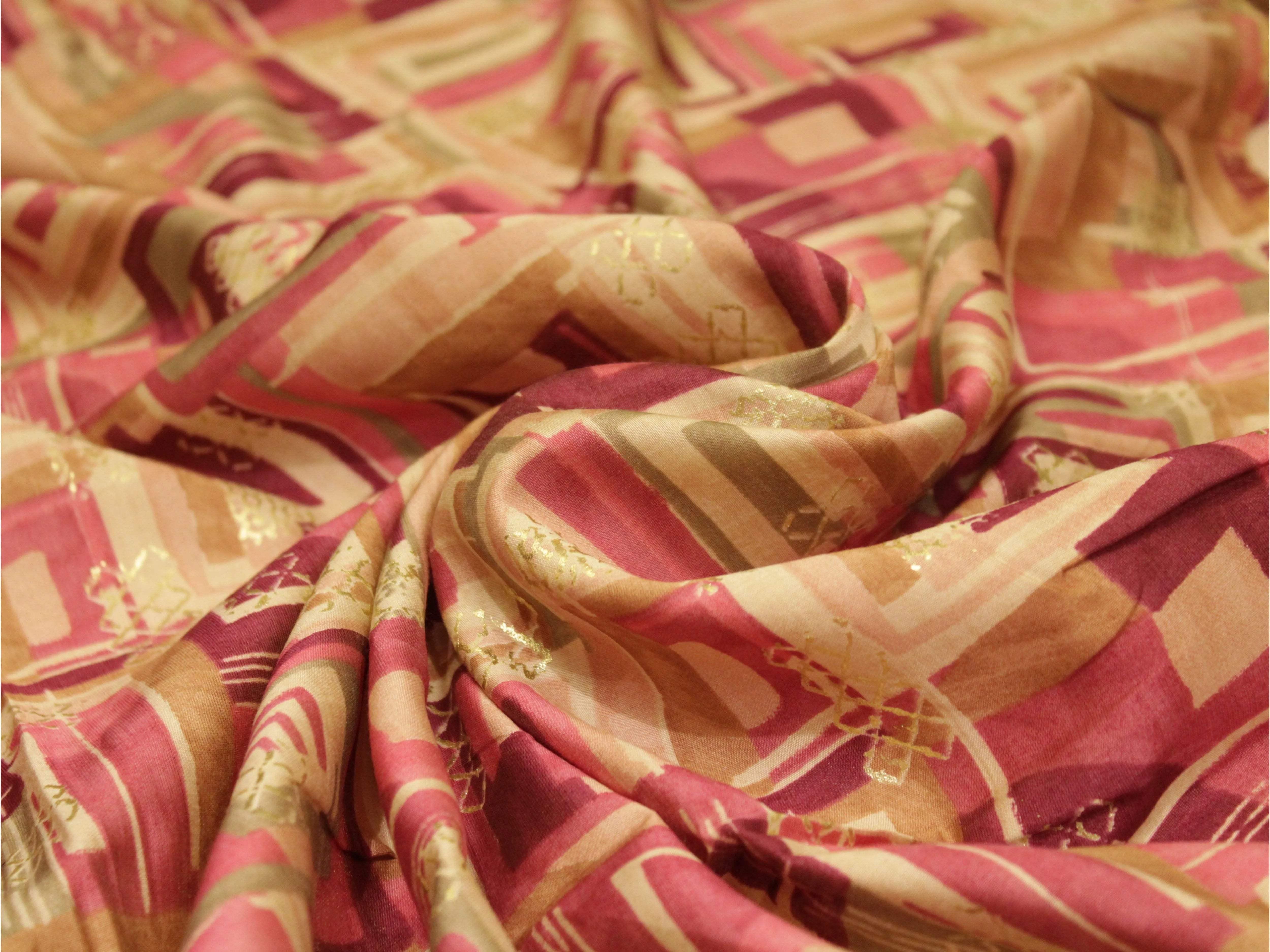 Digital print muslin silk fabric in pink, gold, and beige with geometric pattern