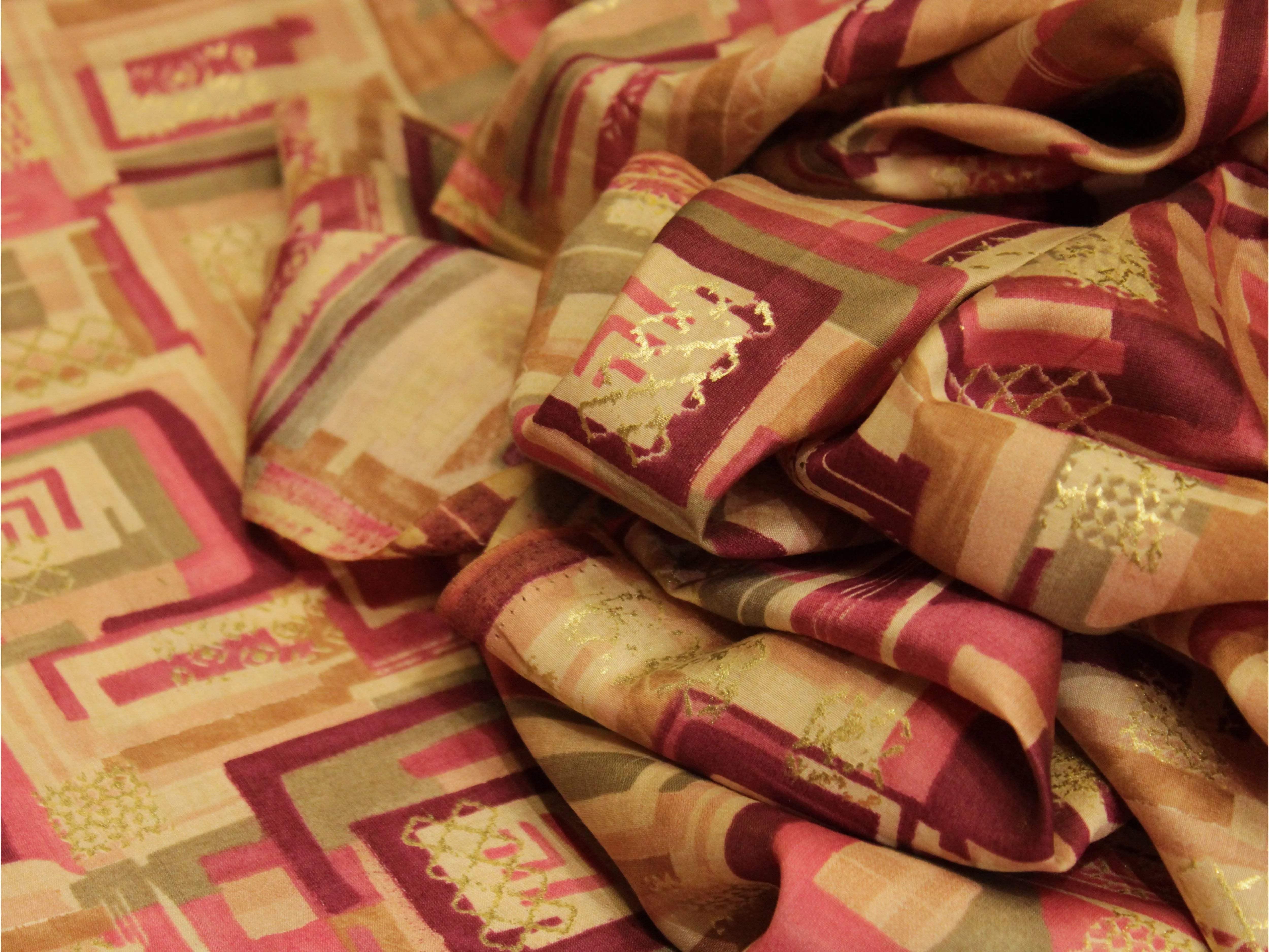 Geometric digital print muslin silk fabric in pink, beige and gold with subtle sheen