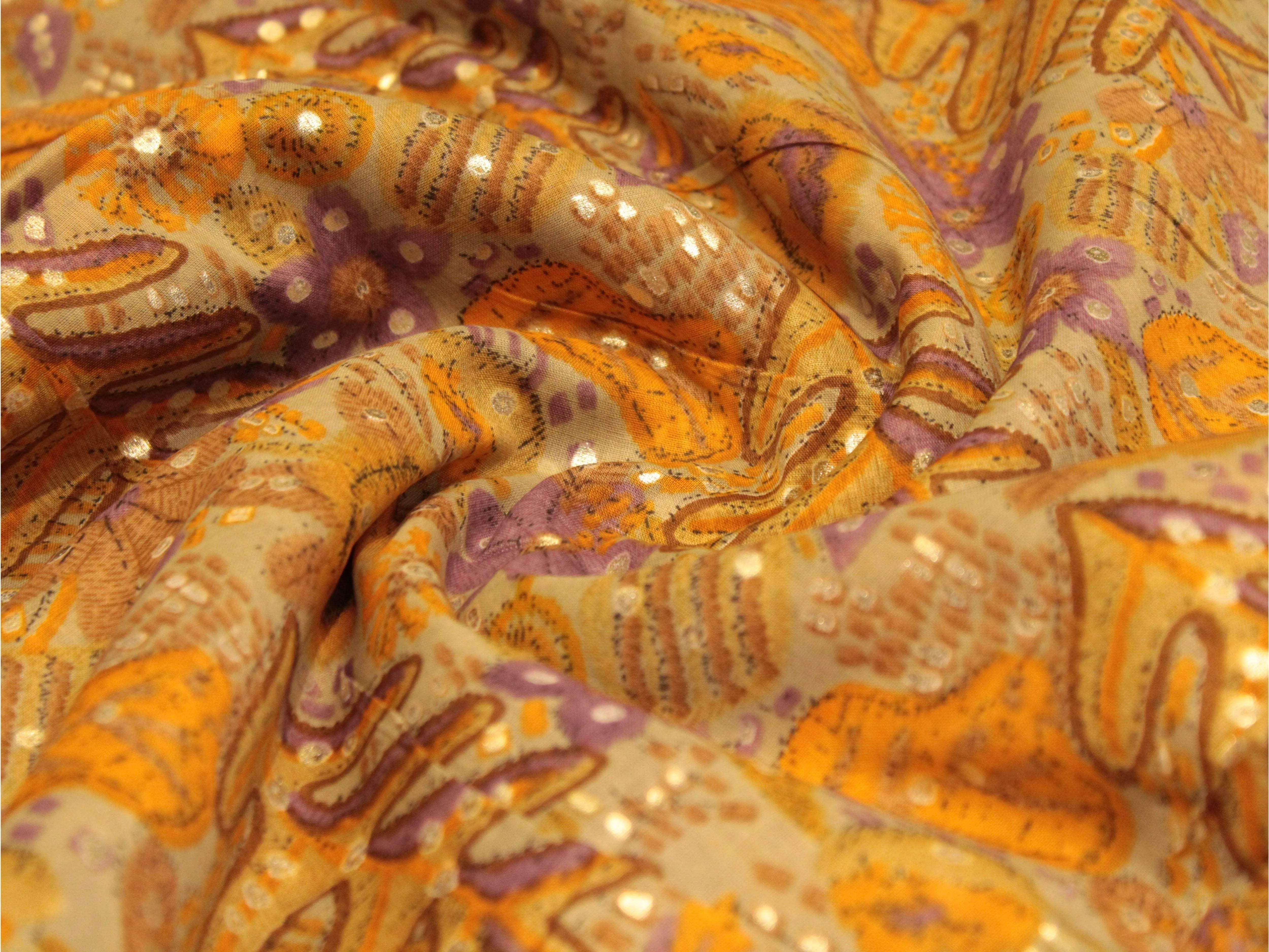 Soft cotton fabric with orange, gold, and purple breeze-inspired printed patterns