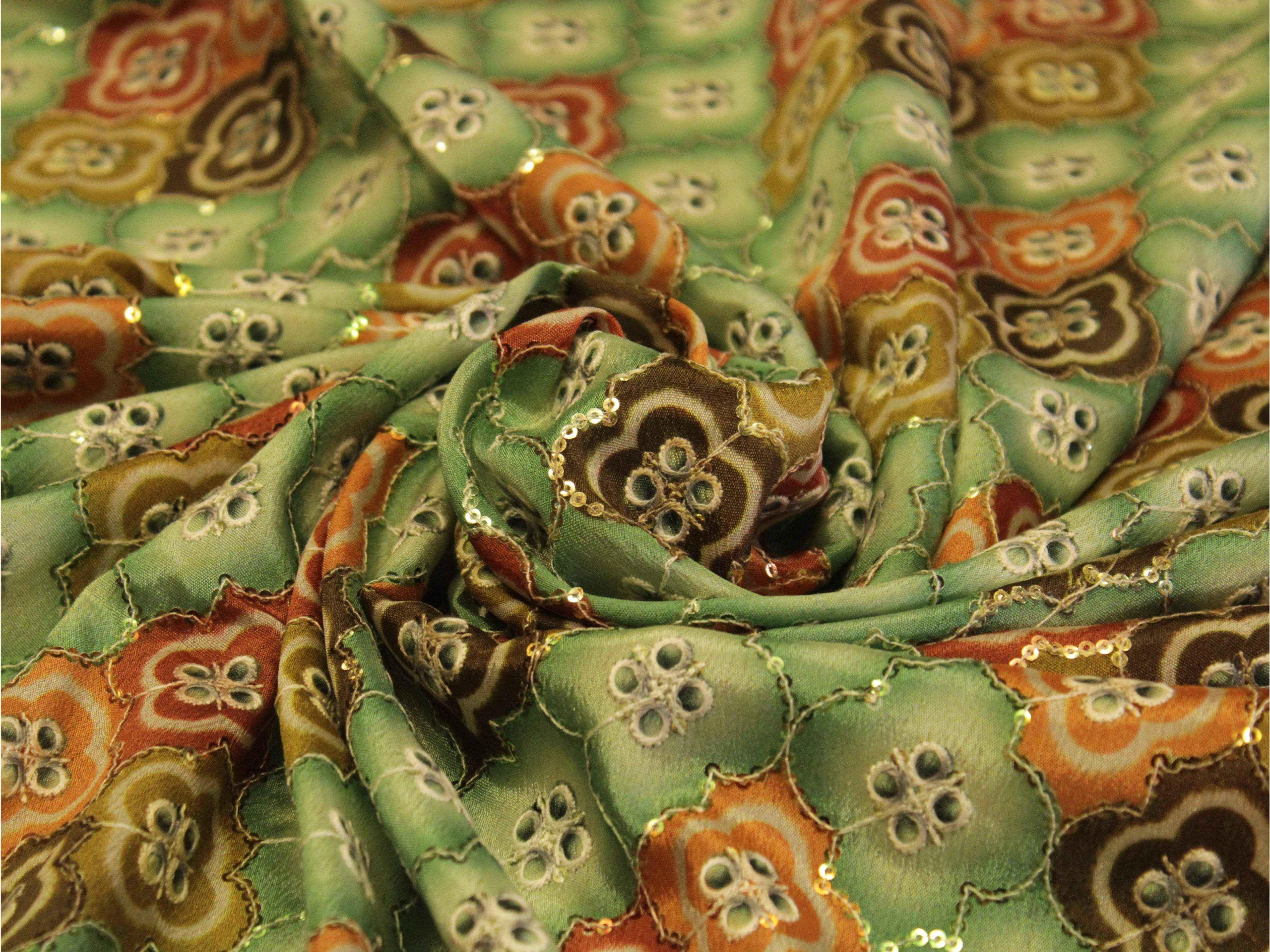 Digital print Chinon silk fabric with green, orange floral motifs and sequin accents