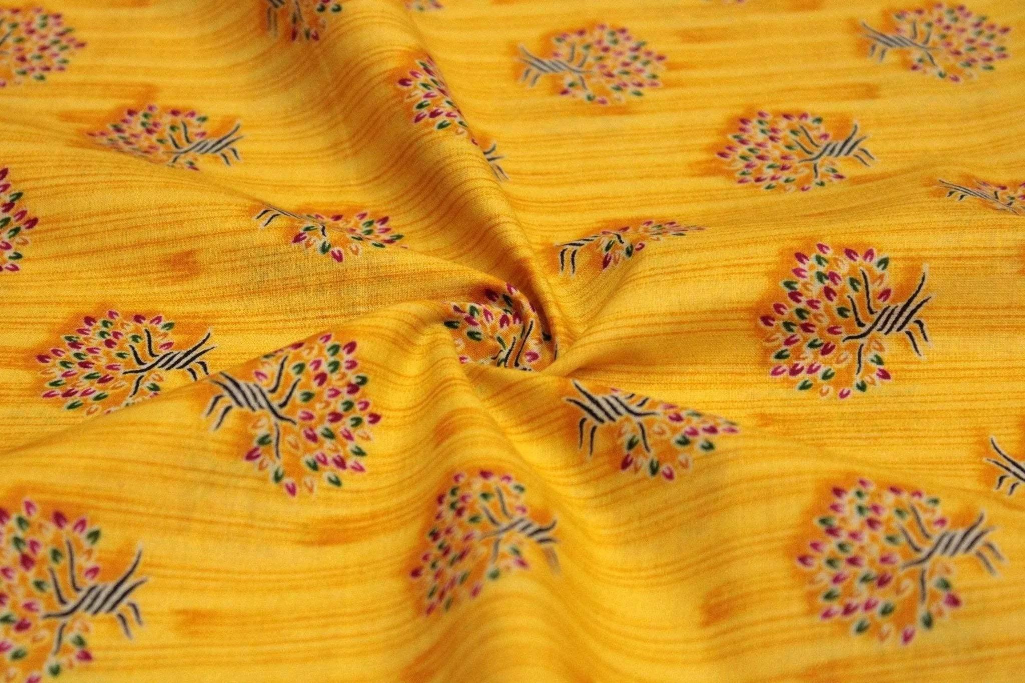 Yellow cotton buti screen print fabric with small tree motifs and textured background