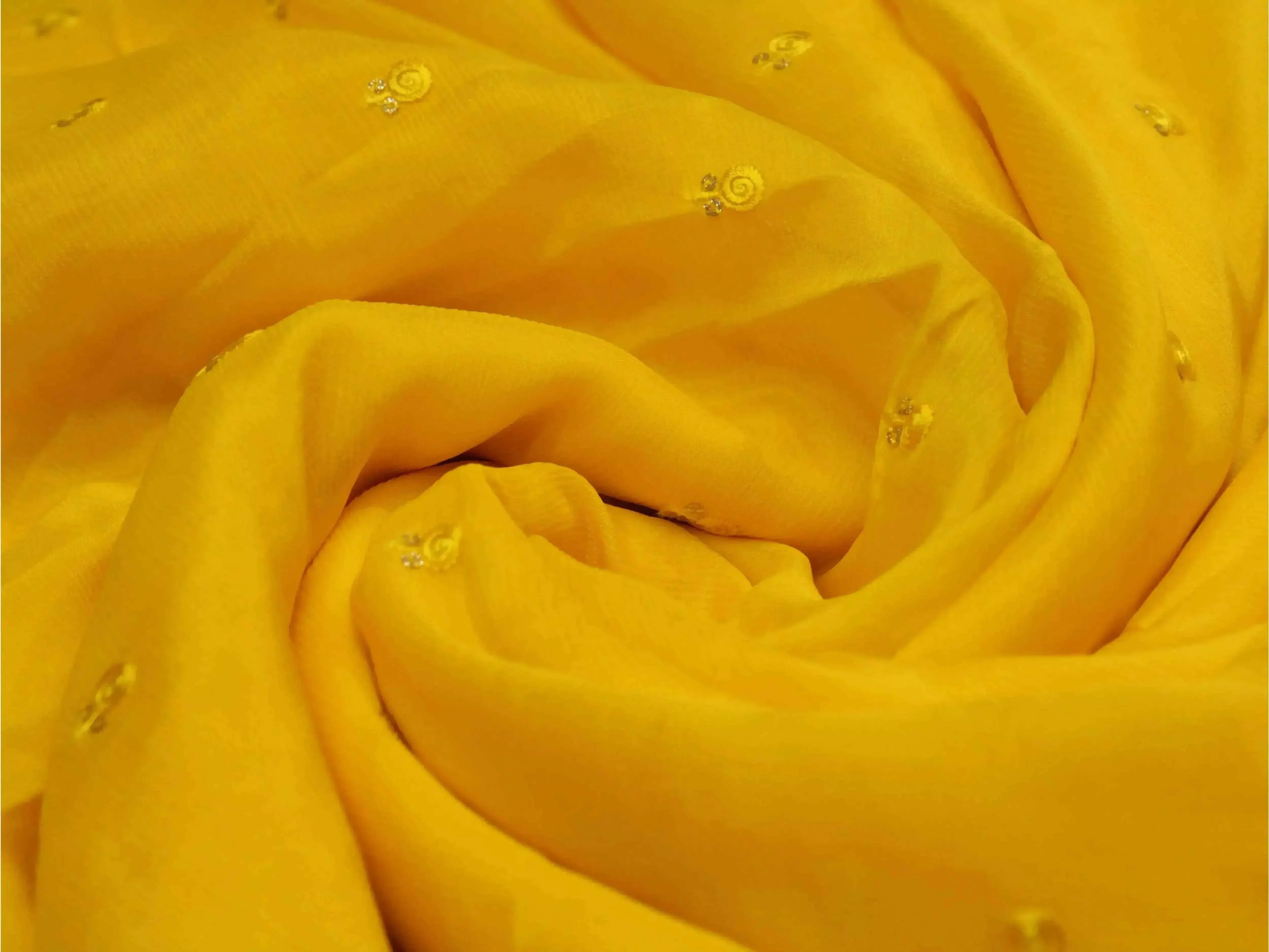 Pure yellow chinon fabric with minimal buti embroidery, soft texture, lightweight material