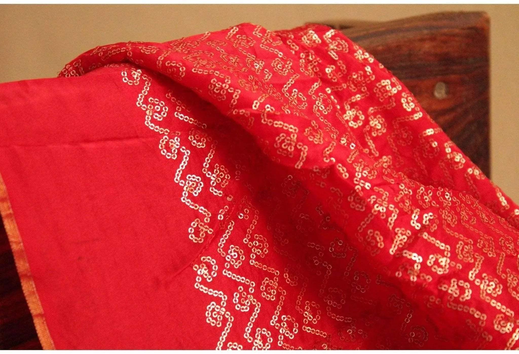Red upada silk fabric with gold micro sequin work and intricate geometric patterns