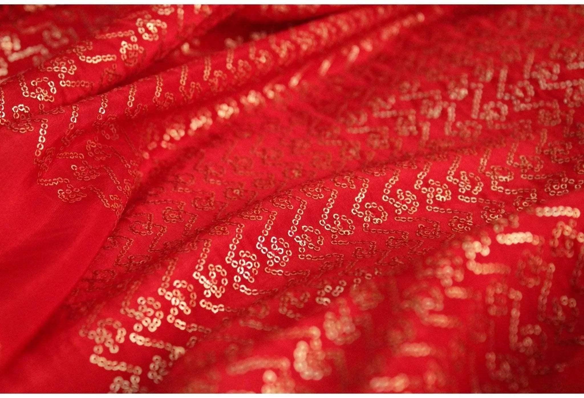Red pure upada silk fabric with intricate gold micro sequin work, ideal for ethnic wear.