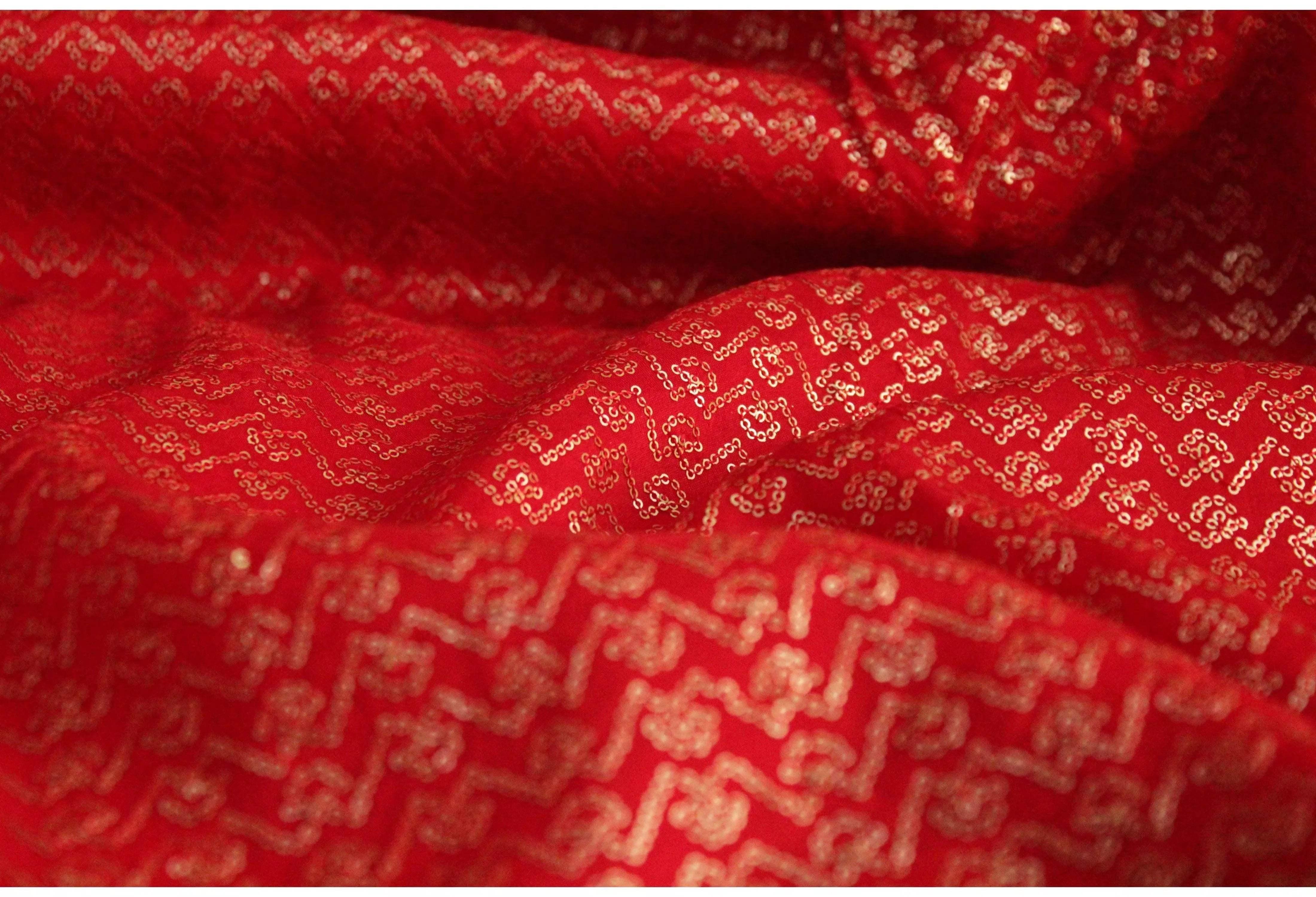 Red pure Upada silk fabric with gold micro sequin work and intricate pattern