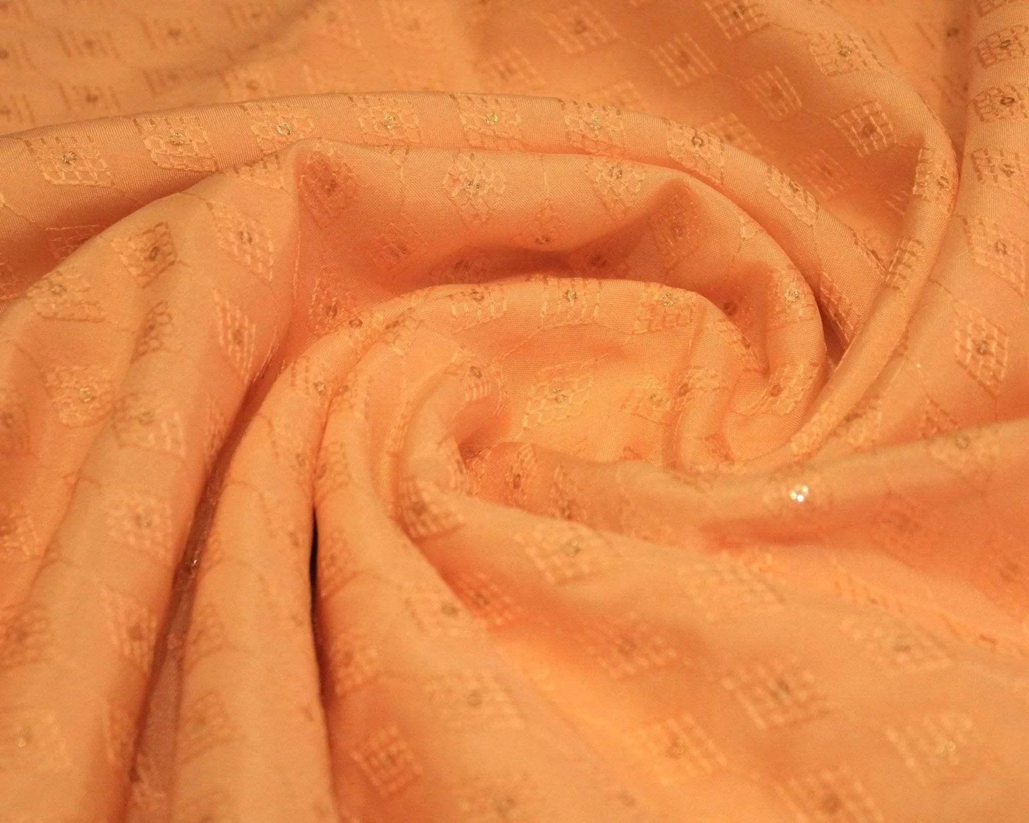 Peach Upada silk fabric with micro thread work and subtle geometric patterns