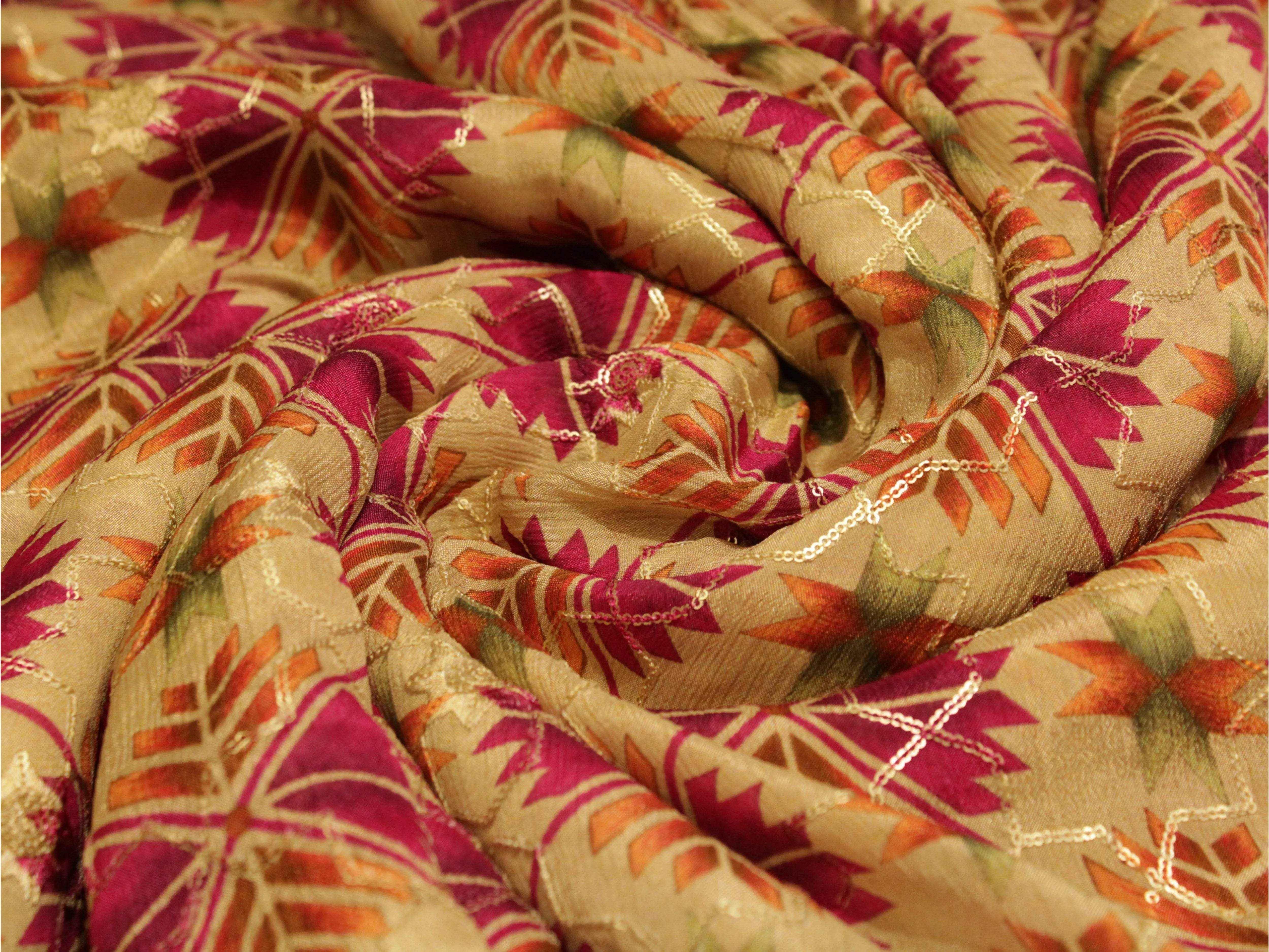 Digital Chinon silk fabric with gold, magenta, and green floral pattern, close-up